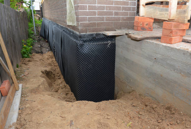 Happy homeowners after waterproofing job in Dorchester